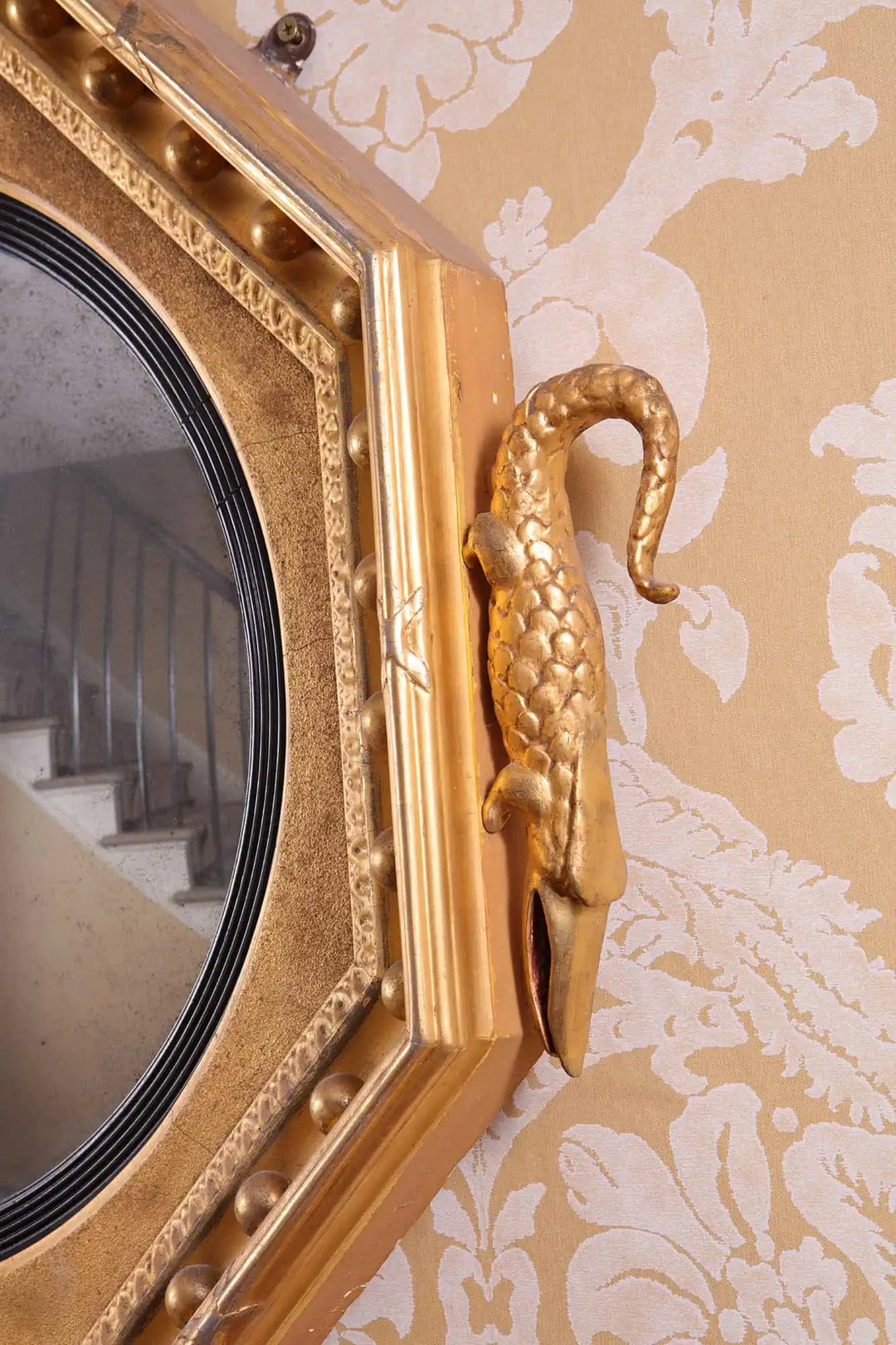 Rare Early 19th Century Regency Octagonal Convex Mirror with giltwood frame and carved crocodile detail.