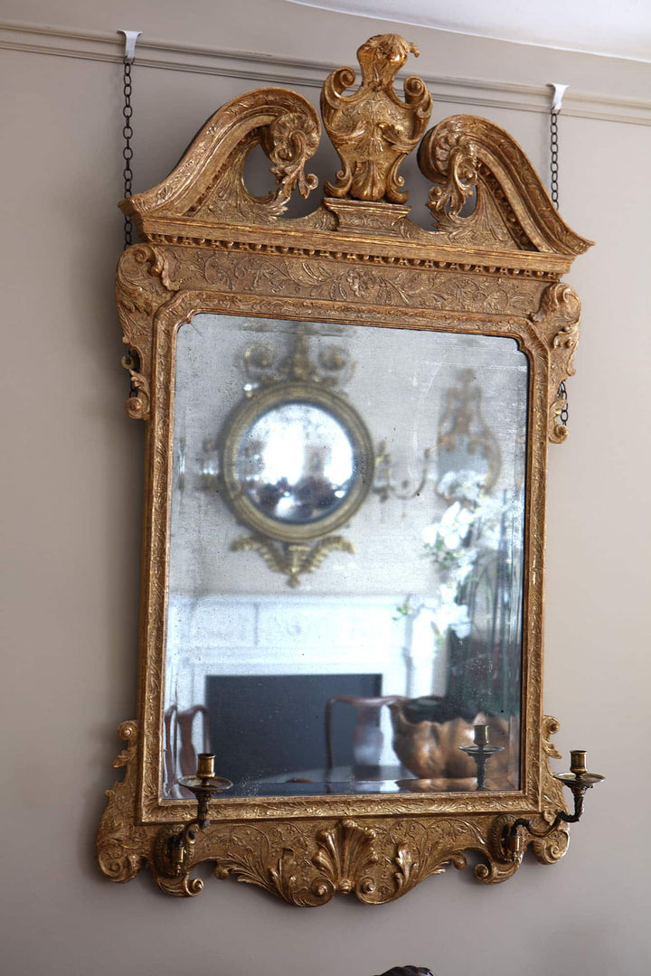 George II gesso Girandole Wall Mirror with gilt carved foliage frame and candle holders, circa 1740 England.