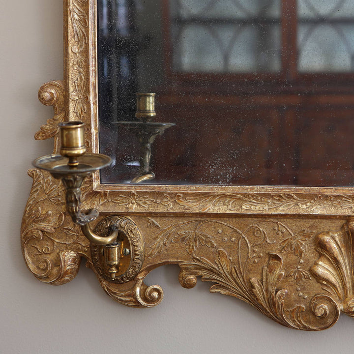 George II gesso Girandole Wall Mirror with gilt carved foliage frame and attached brass candle holder circa 1740.