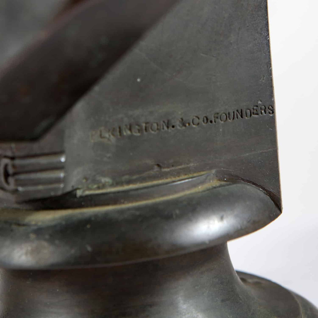 Close-up of stamped signature on bronze bust "William Theed III" showing Elkington & Co. Founders mark.