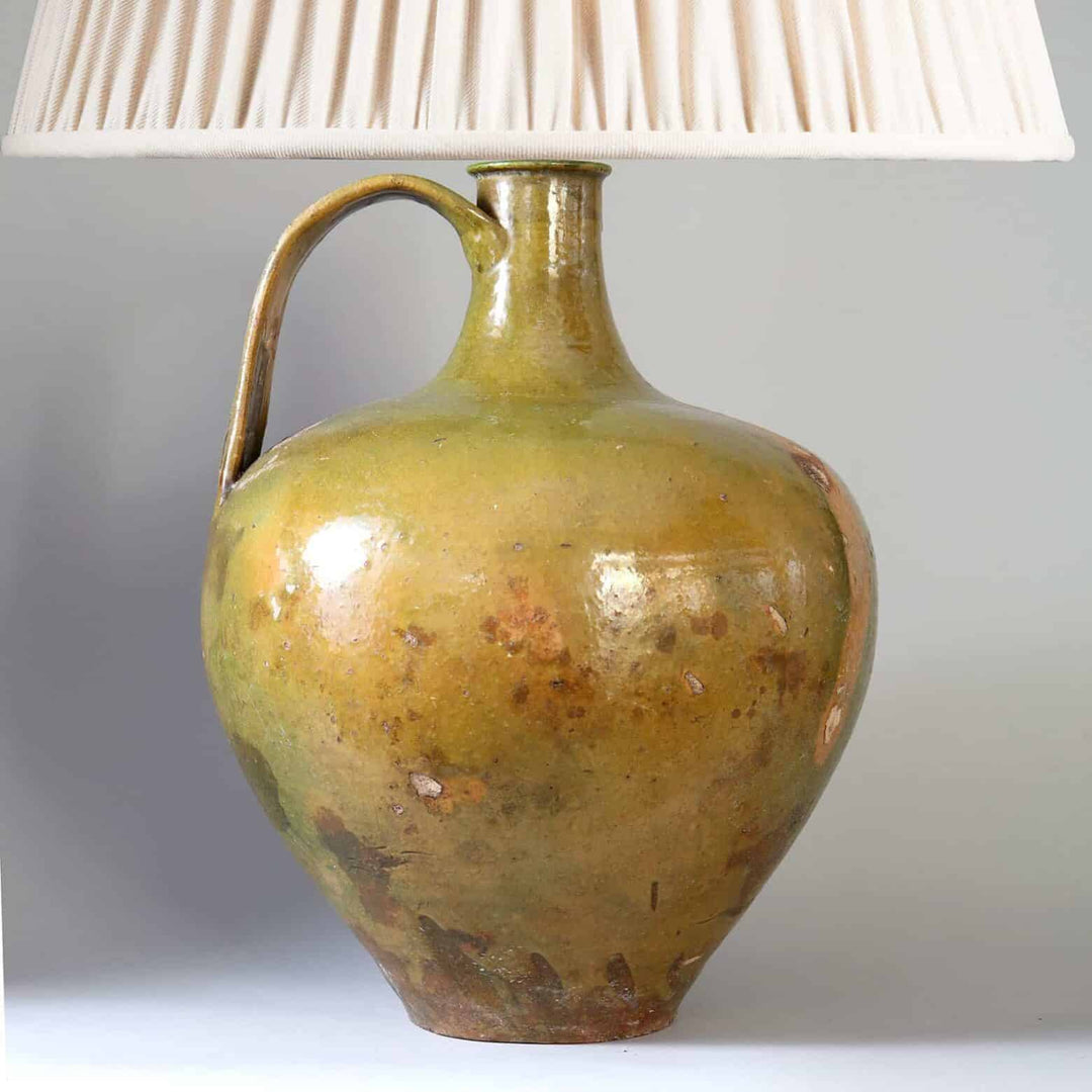 Large Green Glazed jar now mounted as a Table Lamp with curved handle and pleated white shade from Portugal circa 1800