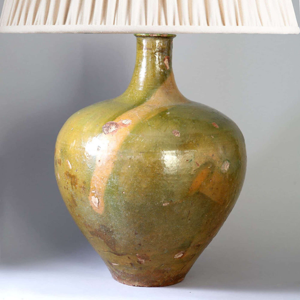 Large Green Glazed jar now mounted as a Table Lamp with rustic finish and soft pleated lampshade.