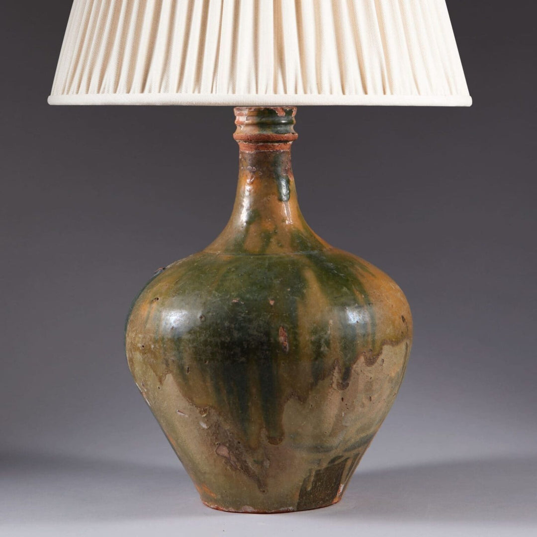 Glazed Ceramic Bottle Vase With Old Restorations Mounted as a Table Lamp with green and brown glaze and pleated white shade