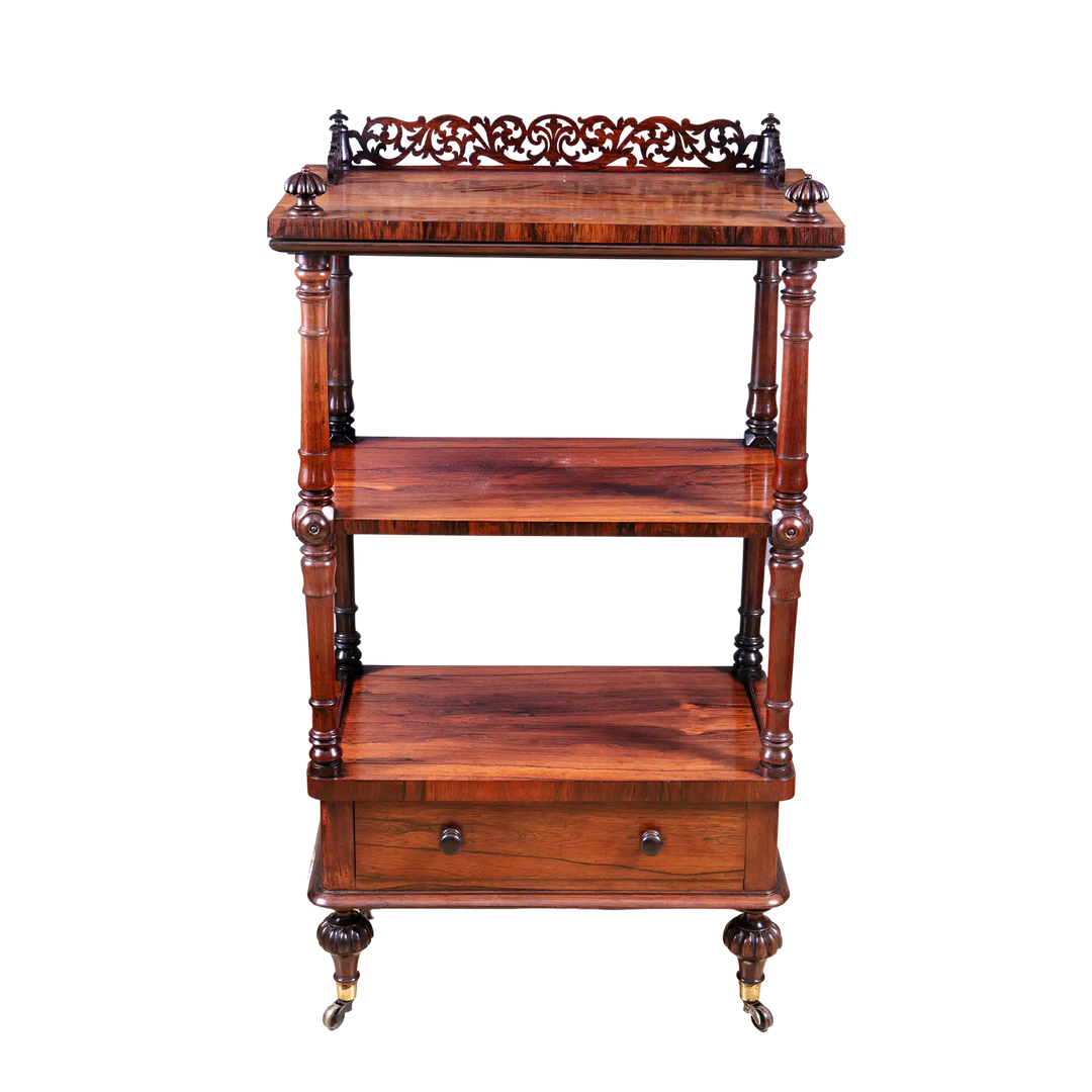 Victorian Rosewood Whatnot Etagere with three tiers, drawer, turned columns, brass castors, circa 1850 English craftsmanship.