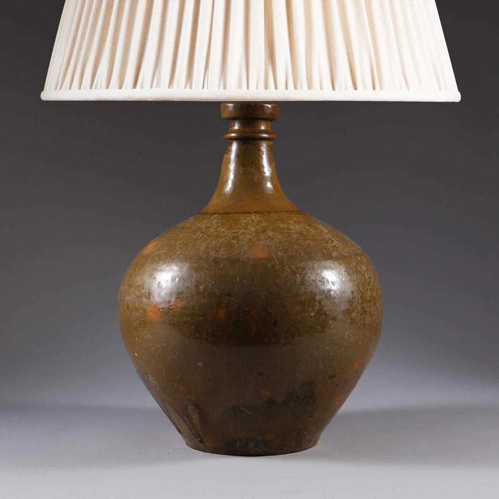 Ceramic Glazed Bottle Vase Mounted as a Table Lamp with brown glazed bottle base and white fabric shade circa 1880.