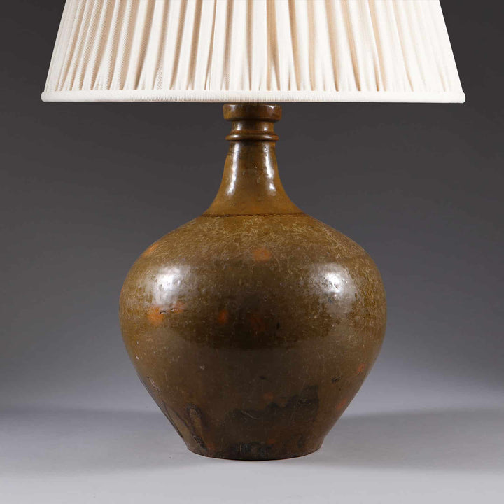 Ceramic Glazed Bottle Vase Mounted as a Table Lamp with brown glazed bottle base and white fabric shade circa 1880.
