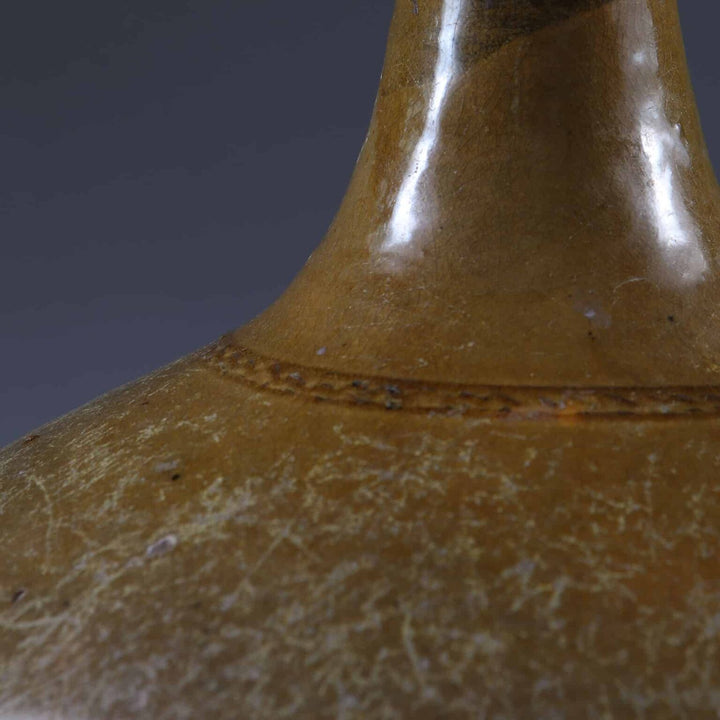 Ceramic Glazed Bottle Vase Mounted as a Table Lamp with glossy brown finish and antique texture close-up view