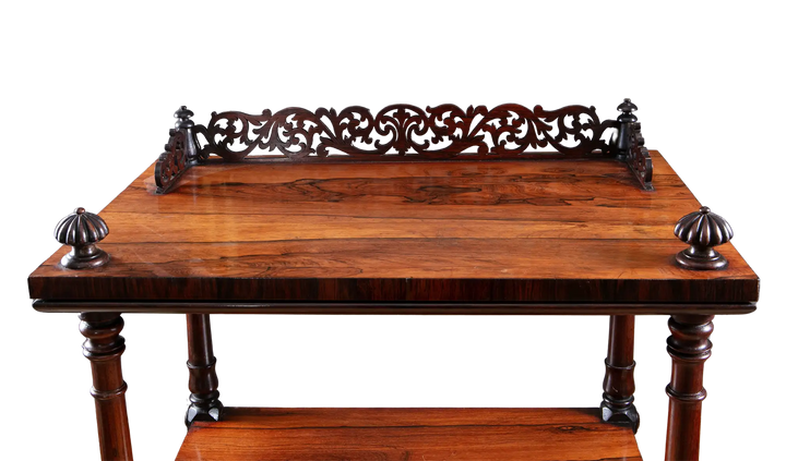 Victorian Rosewood Whatnot Etagere with three tiers, turned legs, carved gallery top, drawer, and brass castors, circa 1850.