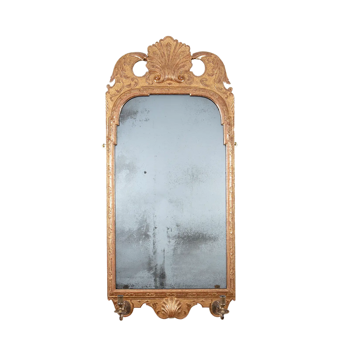 George I Gilt Gesso Girandole wall mirror with shell motifs, scrolling vines, and brass swivel candle arms, circa 1720.