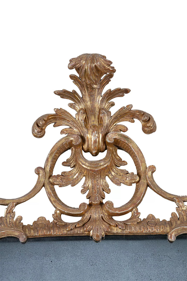 George II Chippendale Giltwood Mirror with intricate rococo giltwood foliage and scrollwork detail on top frame.