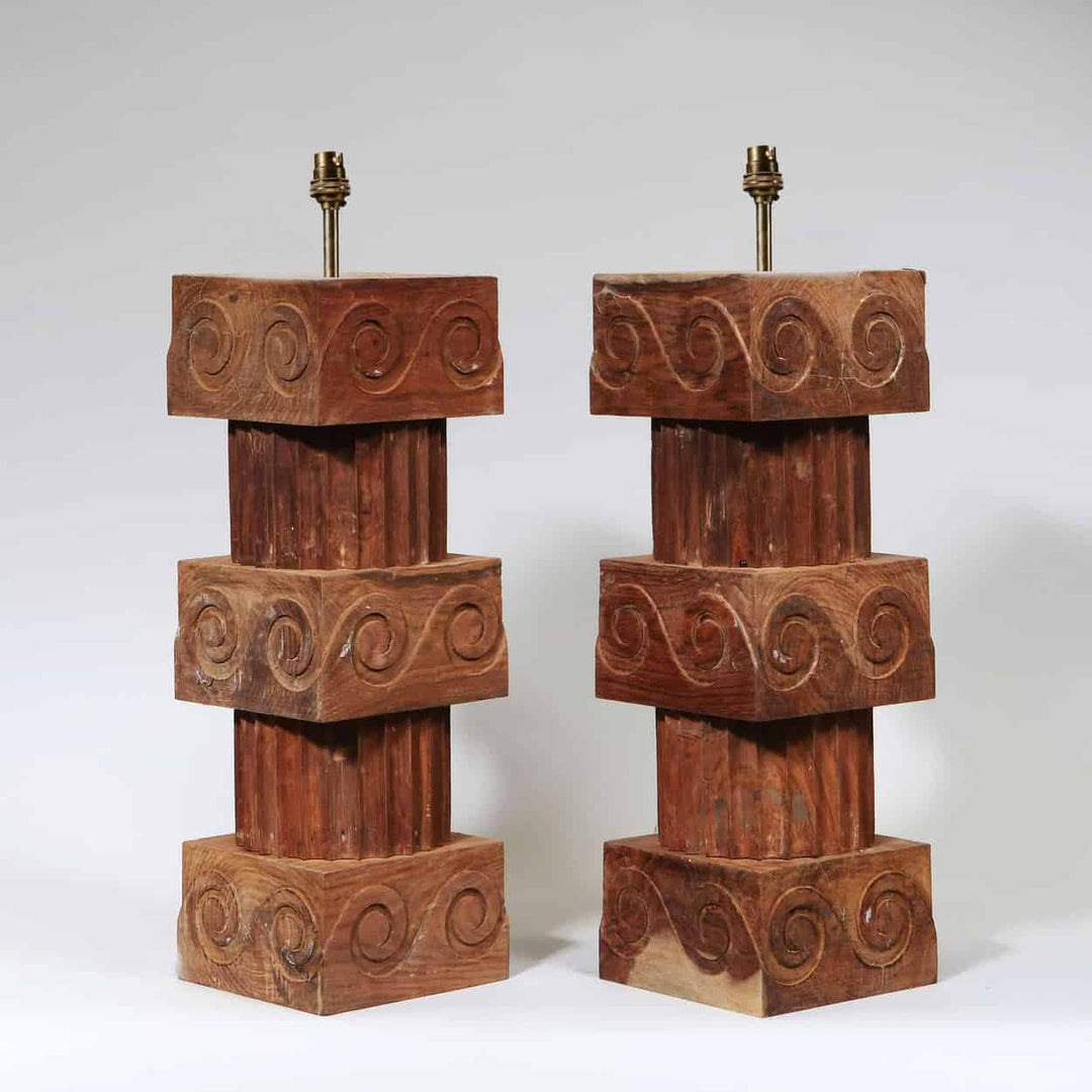 A Pair of Vitruvian Scroll Column Lamps with turned wooden fluted columns and scroll ornament cubes.