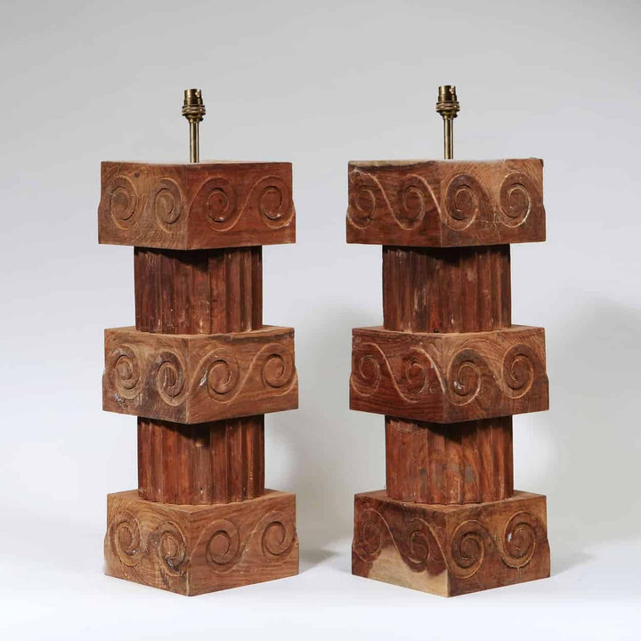 A Pair of Vitruvian Scroll Column Lamps with turned wooden fluted columns and scroll ornament cubes.