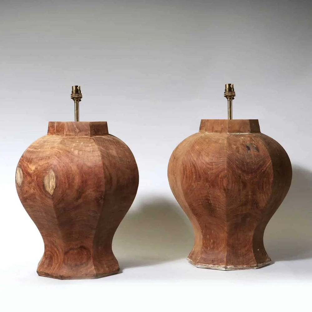 A Pair of Faceted Octagonal Wooden Lamps with a natural wood finish, France circa 2000, 37 cm diameter, 43 cm height.