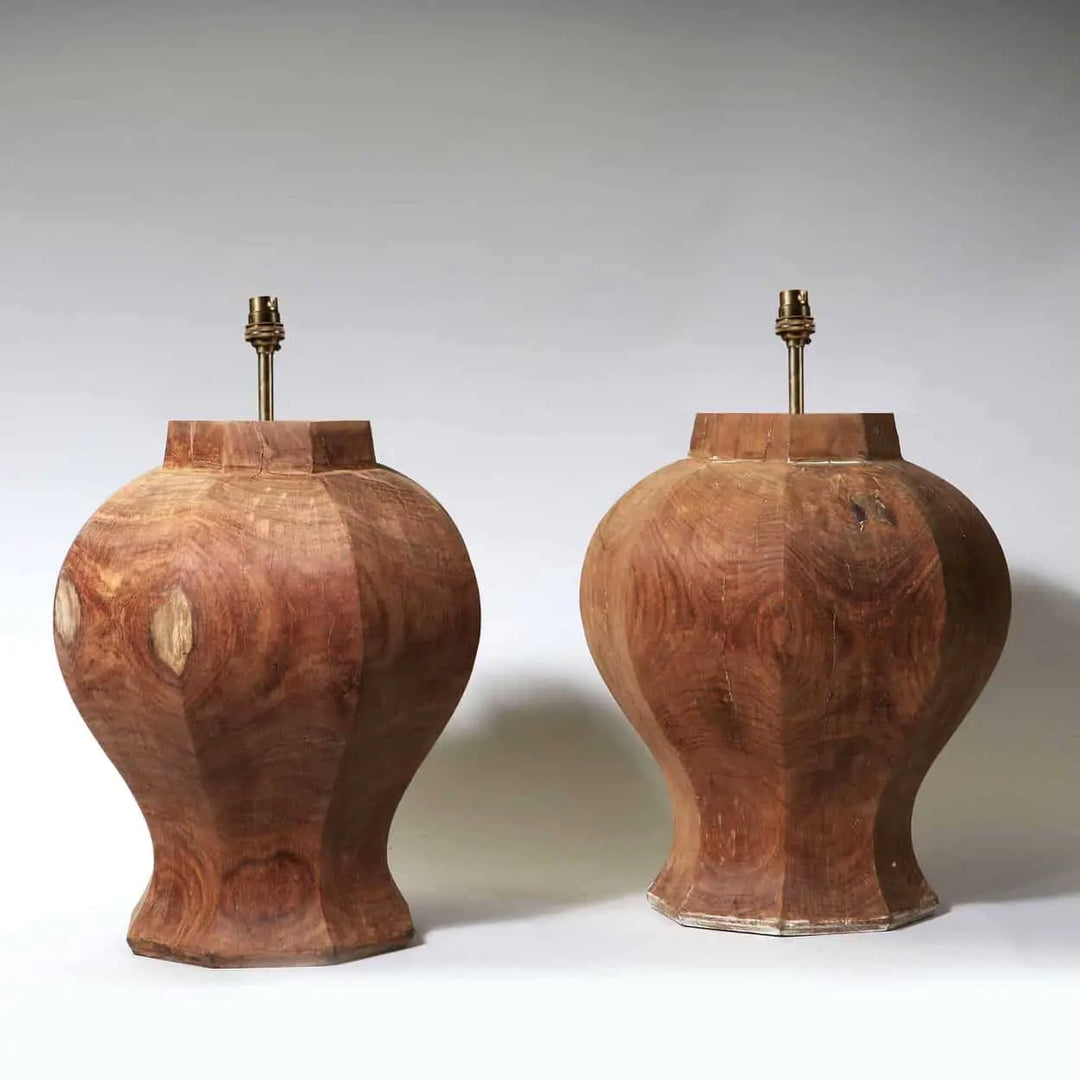 A Pair of Faceted Octagonal Wooden Lamps with a natural wood finish, France circa 2000, 37 cm diameter, 43 cm height.