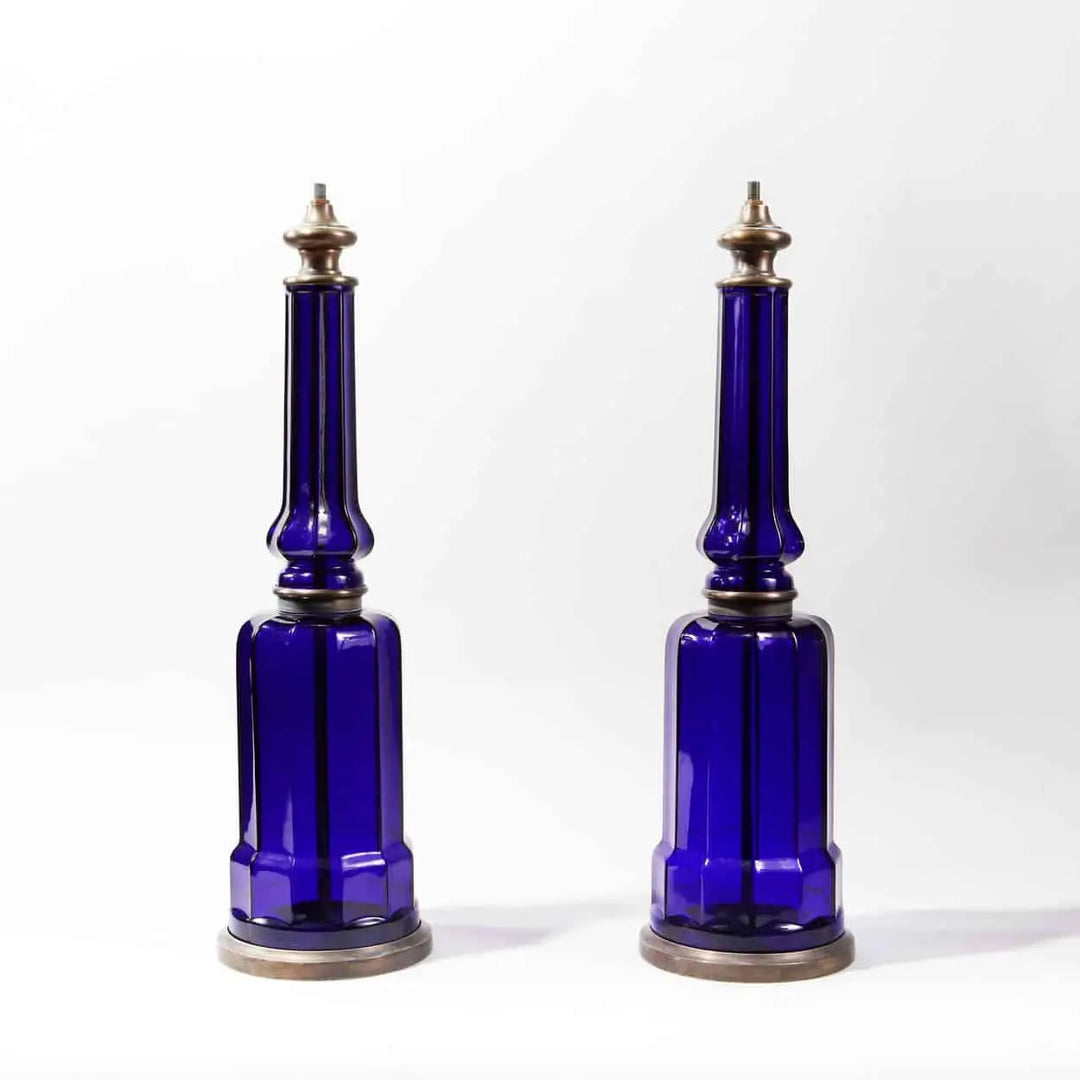 Pair of Blue Glass Column Table Lamps with rich blue glass and patinated metal bases and tops, 53 cm tall.