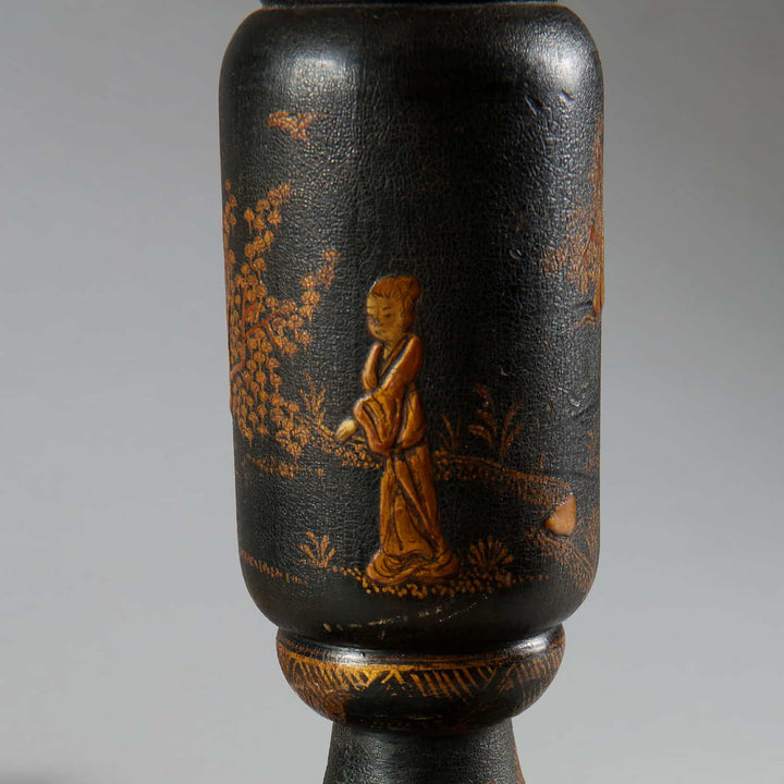 Chinoiserie Black and Gilt lacquered Table Lamp with detailed Asian figure and floral design, circa 1900, continental style.