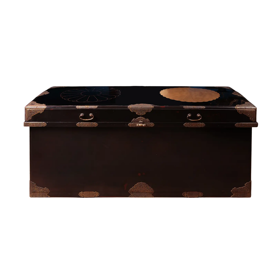Edo Japanese Black Lacquer and Gilt Trunk with domed lid, brass mounts, drop handles, and polished black lacquer finish.