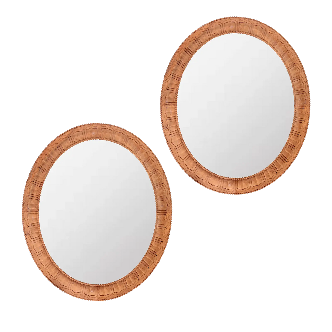 Pair of Carved Wooden Oval Mirrors with detailed frames by Andrew Allfree, measuring 99 x 85 cm, Circa Modern style.