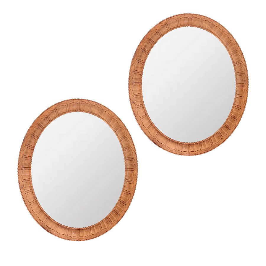 Pair of Carved Wooden Oval Mirrors with detailed frames by Andrew Allfree, measuring 99 x 85 cm, Circa Modern style.