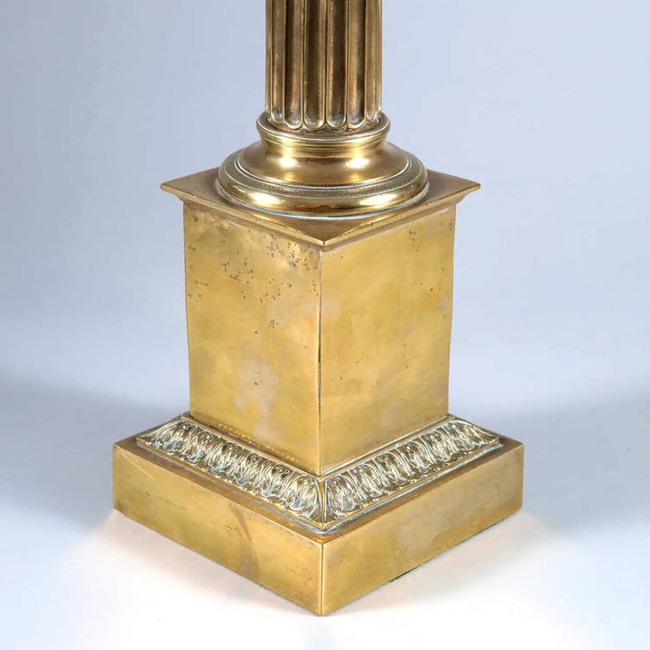 Fluted Brass Column Lamp with a stepped brass base and foliate detail, circa 1900, late 19th century design.