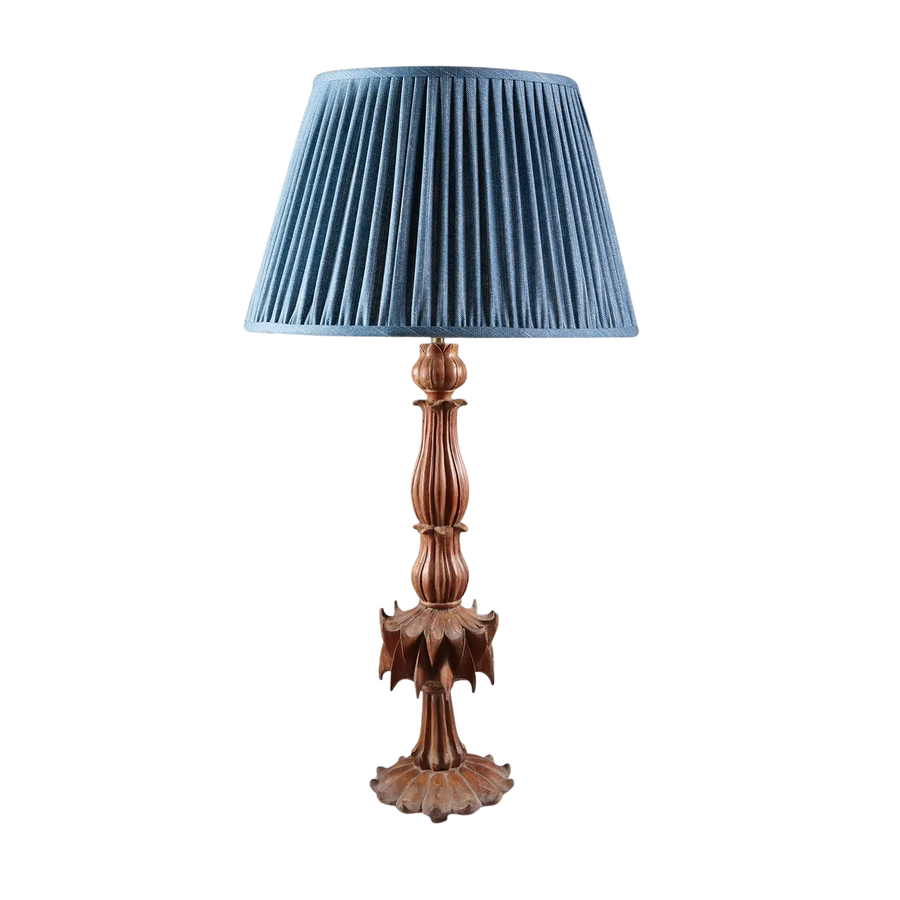 Futuristic Carved Teak Table Lamp with reeded stem, petal base, claw-like centerpiece, and blue pleated shade.