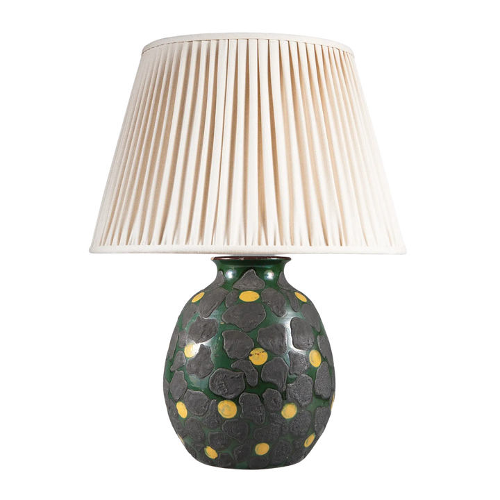 Green Glazed Lamp with Charcoal Dots and Yellow Accents with pleated white lampshade and textured base design.