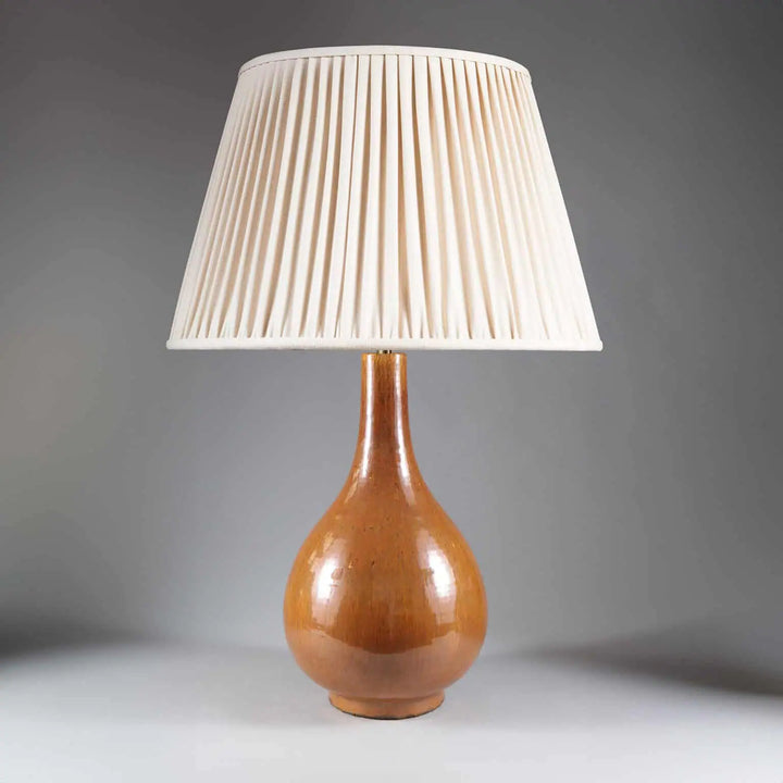 Tall Monochrome Vase Table Lamp featuring a brown glazed porcelain vase base with a pleated cream lampshade.