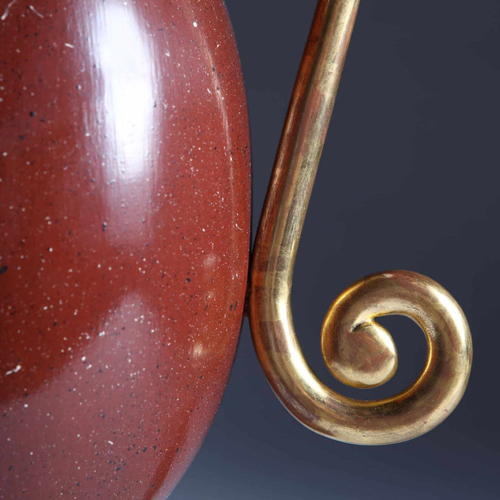 Close-up of Faux Porphyry Baluster Lamps by Andrew Allfree showing painted vase and gold-leaf scroll arm details.