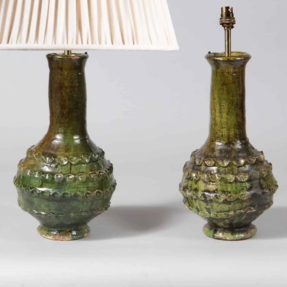 Pair of Green Glazed Bottle Vases as Table Lamps with incised patterns and tall pottery bottle bases in green glaze
