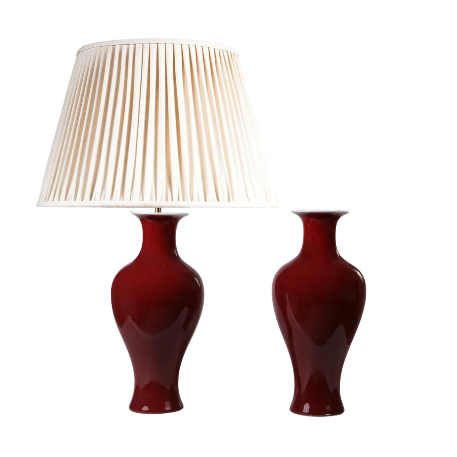 Pair of Sang De Boeuf Vases as Table Lamps with deep red glossy finish, one with white pleated lampshade.