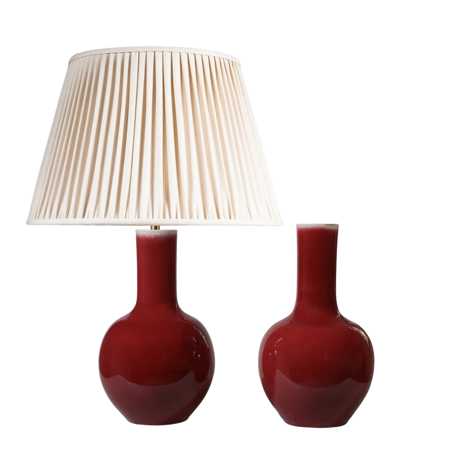 Pair of Ox Blood Glazed Porcelain Bottle Vases as Table Lamps with one lamp shade and one vase without shade.