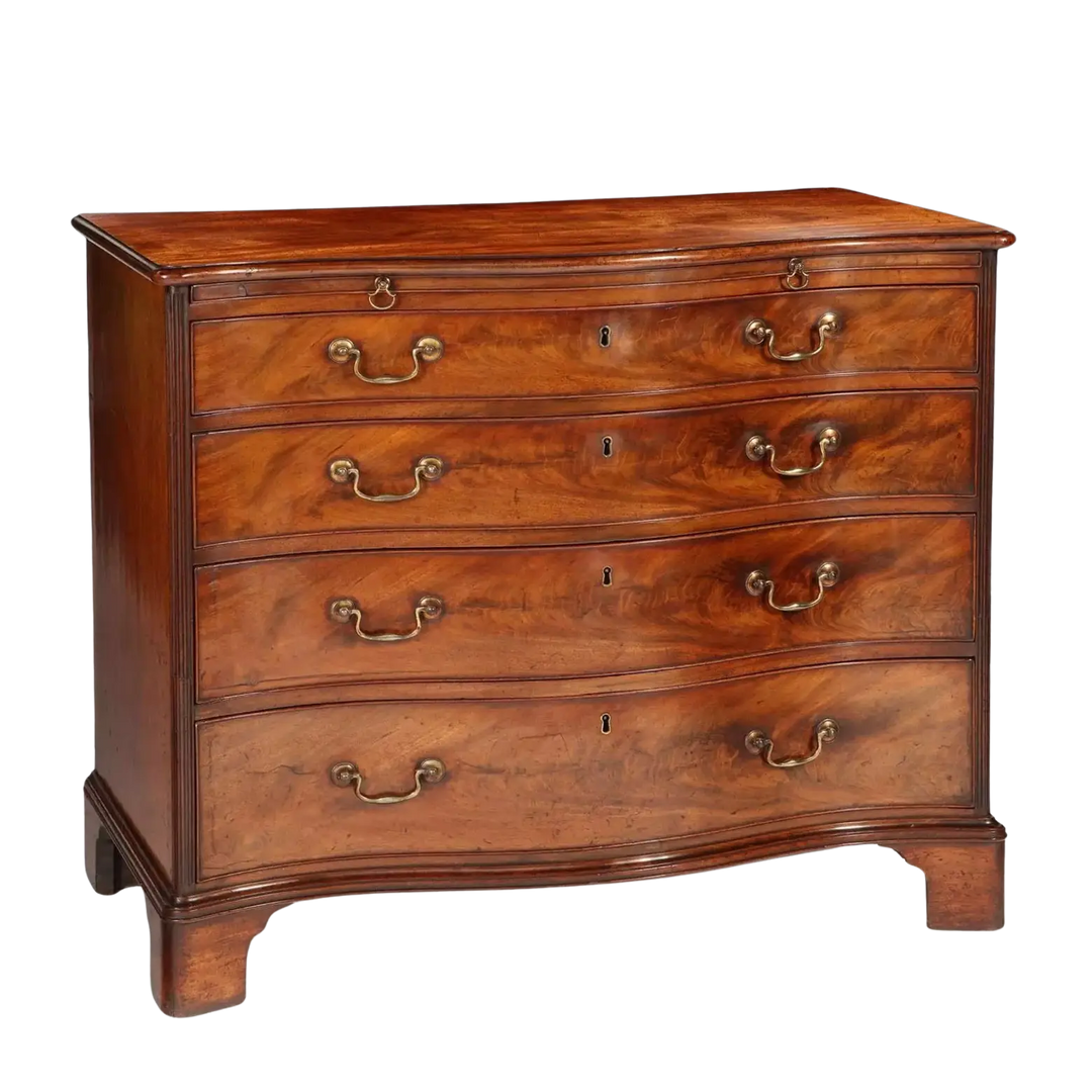 Fine George III Chippendale Chest Of Drawers in mahogany with reeded columns and original gilt swan-neck handles.