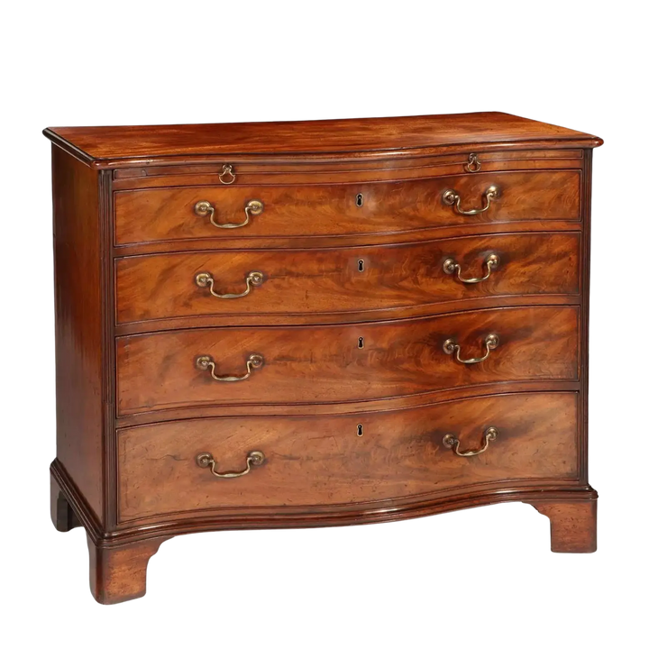 Fine George III Chippendale Chest Of Drawers in mahogany with reeded columns and original gilt swan-neck handles.