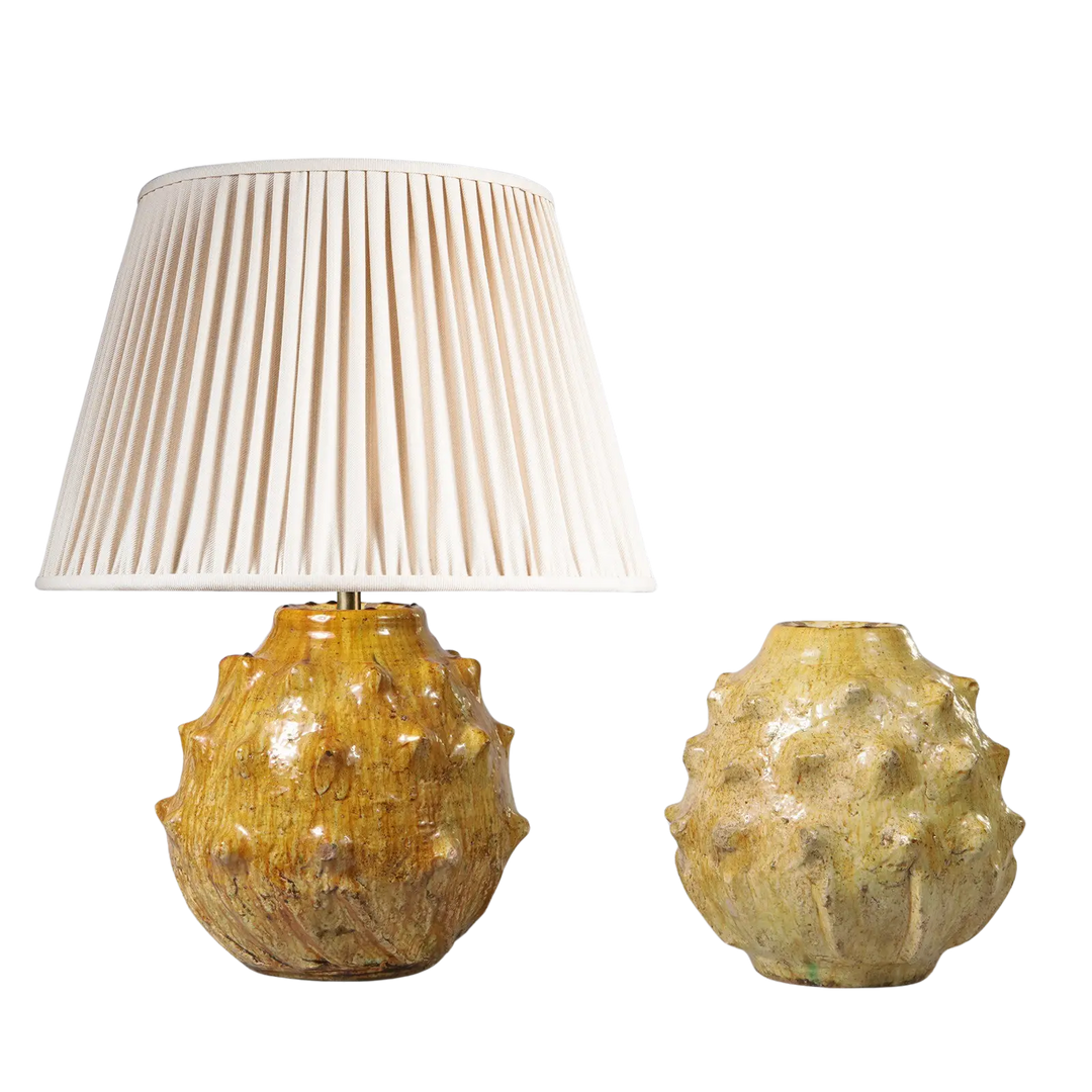 Spiked Green bottle Vase as a Table Lamp with textured spiked design and cream pleated lampshade, decorative home lighting.