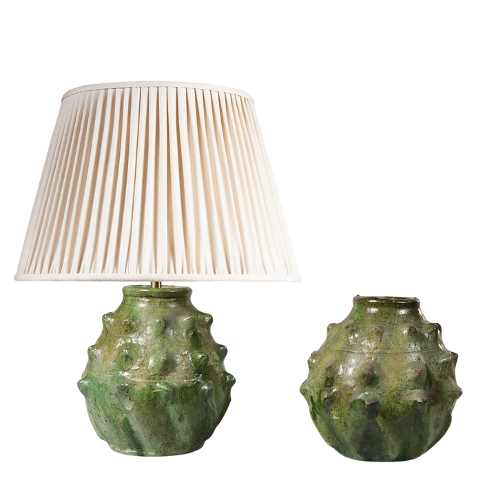 Spiked Green bottle Vase as a Table Lamp with textured green ceramic base and cream pleated lampshade on one vase.