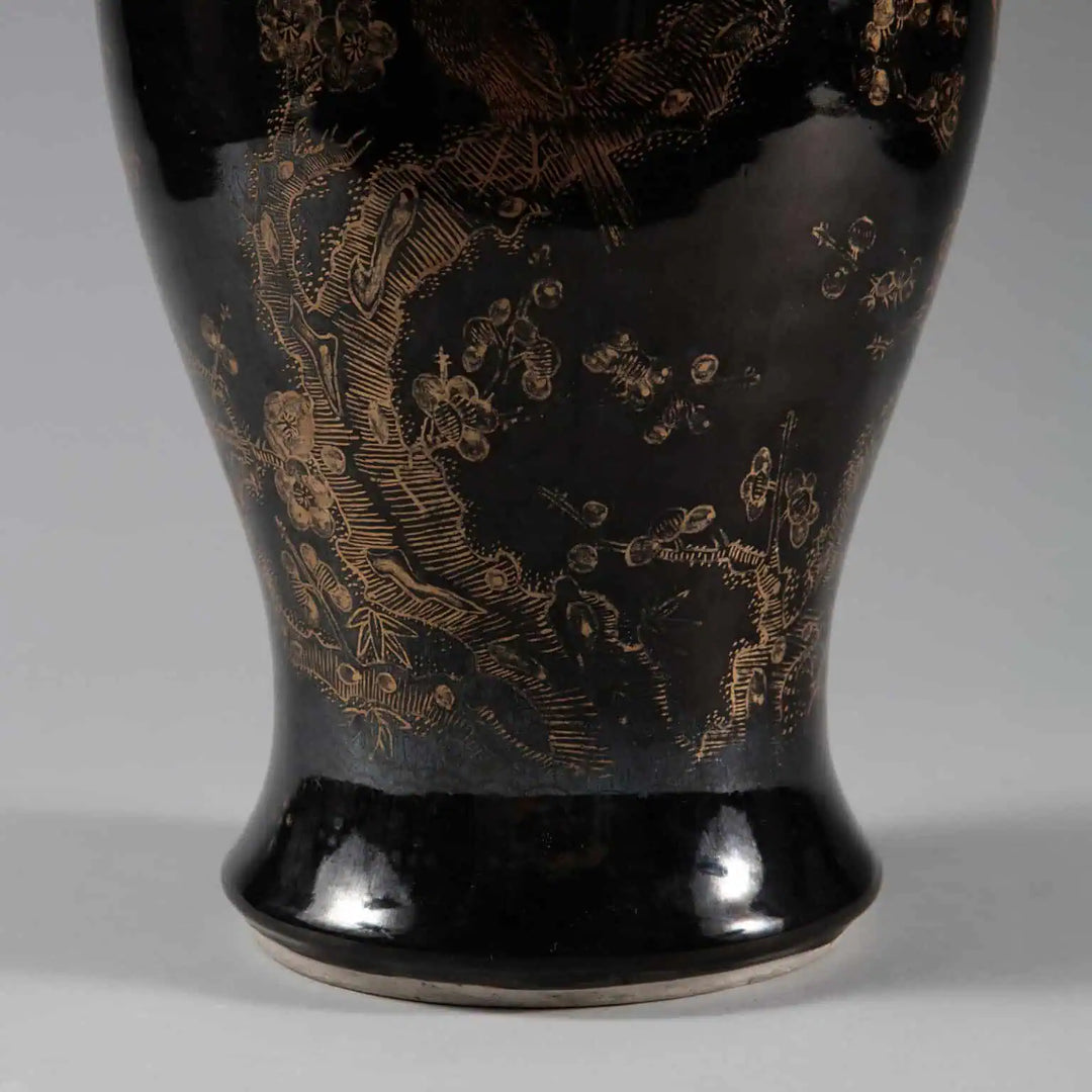 A Chinese Export Black Glazed and Gilt Table Lamp with gilt prunice blossom and birds on black glaze.