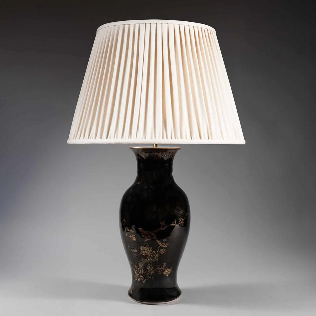 A Chinese Export Black Glazed and Gilt Table Lamp with 18th century black glaze and gilt floral design.