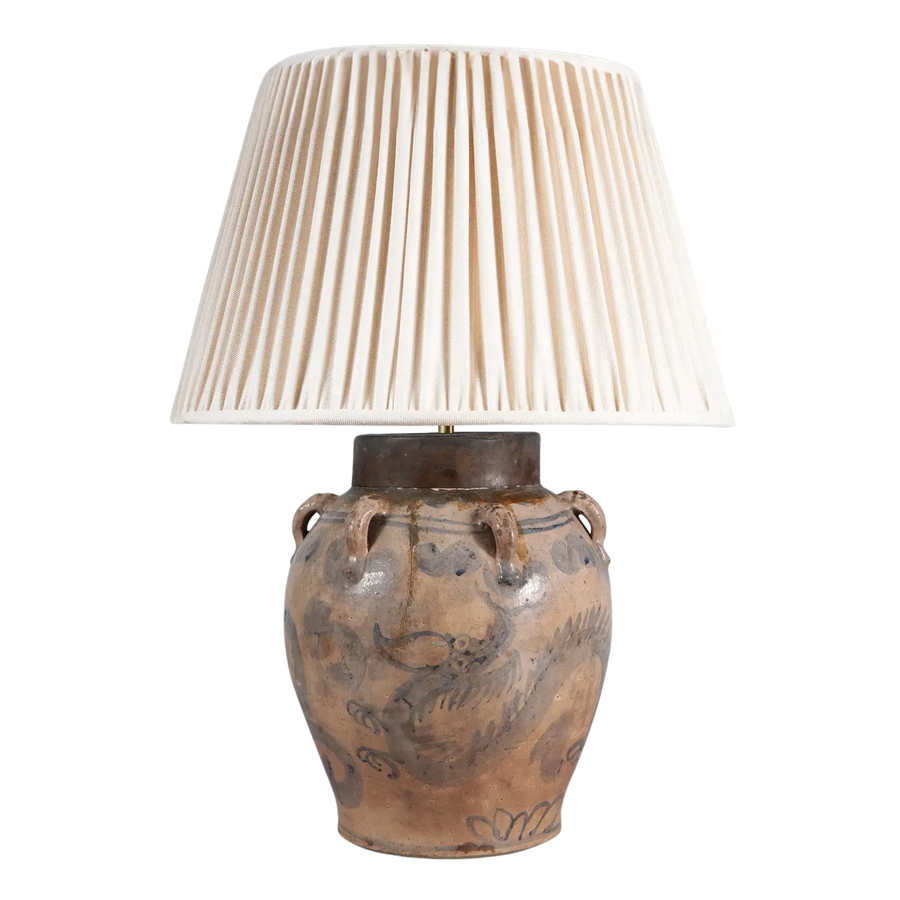 17th Century South China Sea Pottery Table Lamp with blue dragon design and copper collar, pleated cream lampshade.