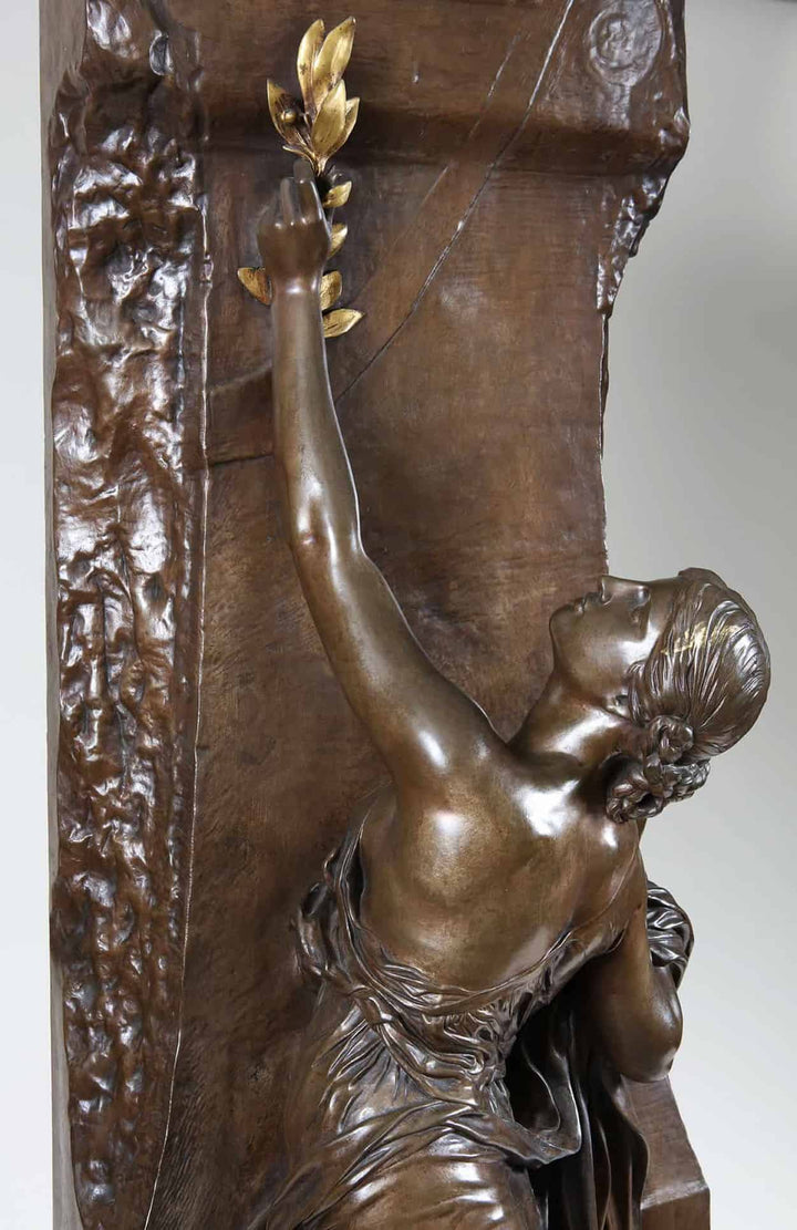 Henri Michel Chapu bronze sculpture “La Jeunesse” depicting a woman reaching upward holding a laurel branch.