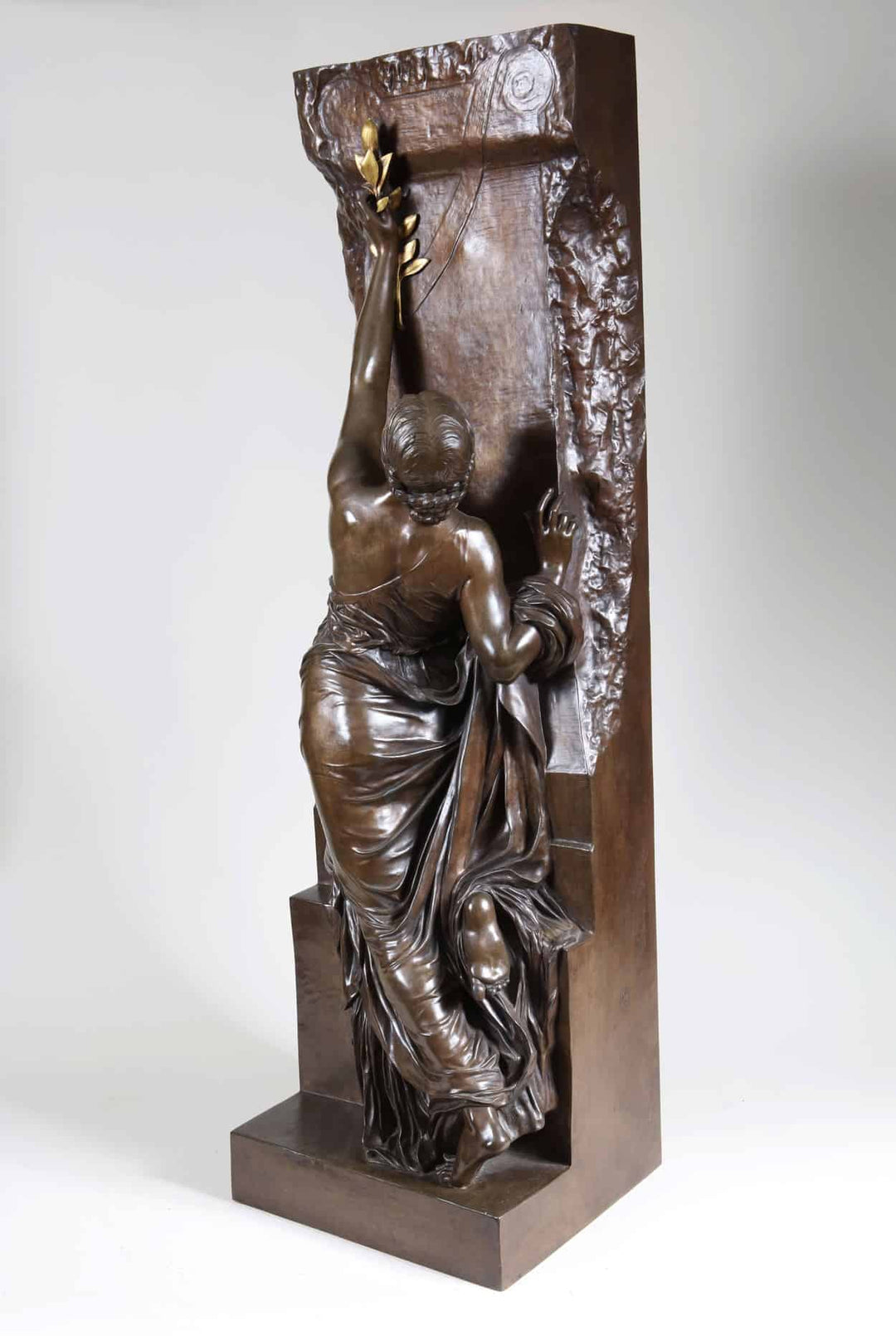 Henri Michel Chapu bronze sculpture La Jeunesse depicting a woman reaching upward with draped clothing.