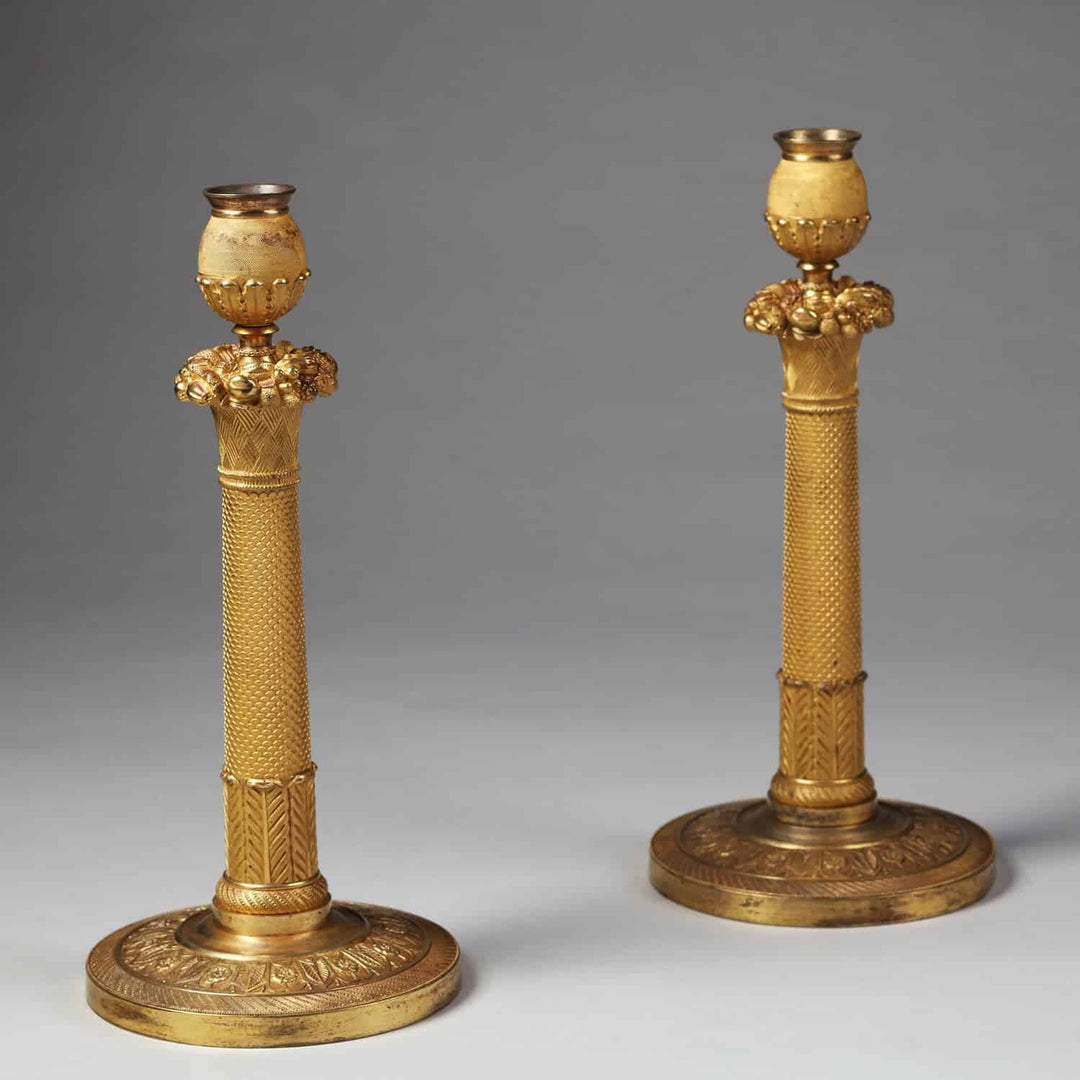 Pair of French Empire Gilt Bronze Candlesticks