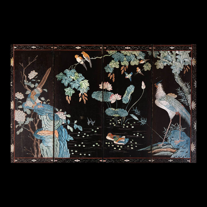 An early 19th century four fold Chinese lacquer screen