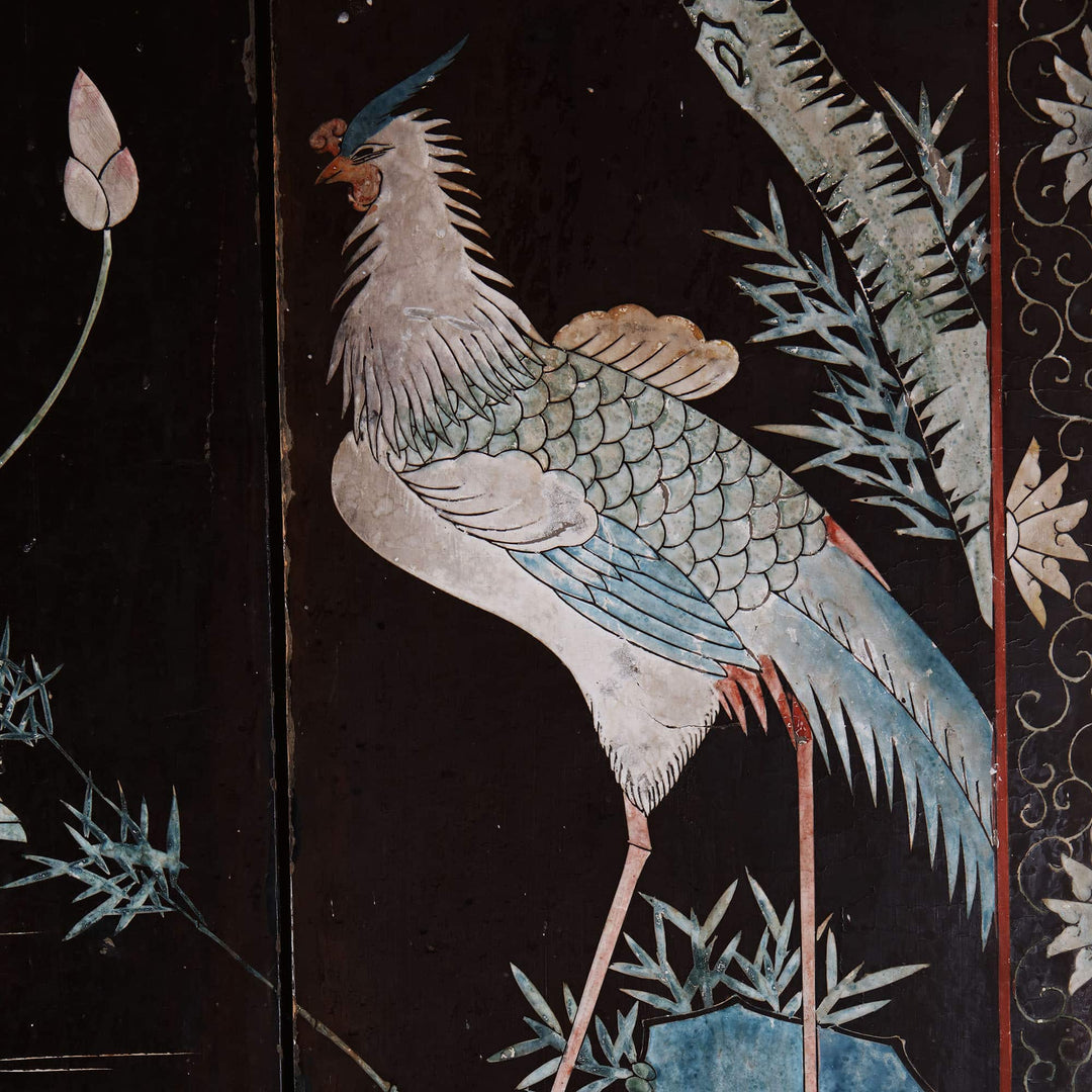 An early 19th century four fold Chinese lacquer screen