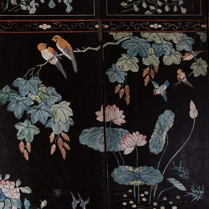 An early 19th century four fold Chinese lacquer screen