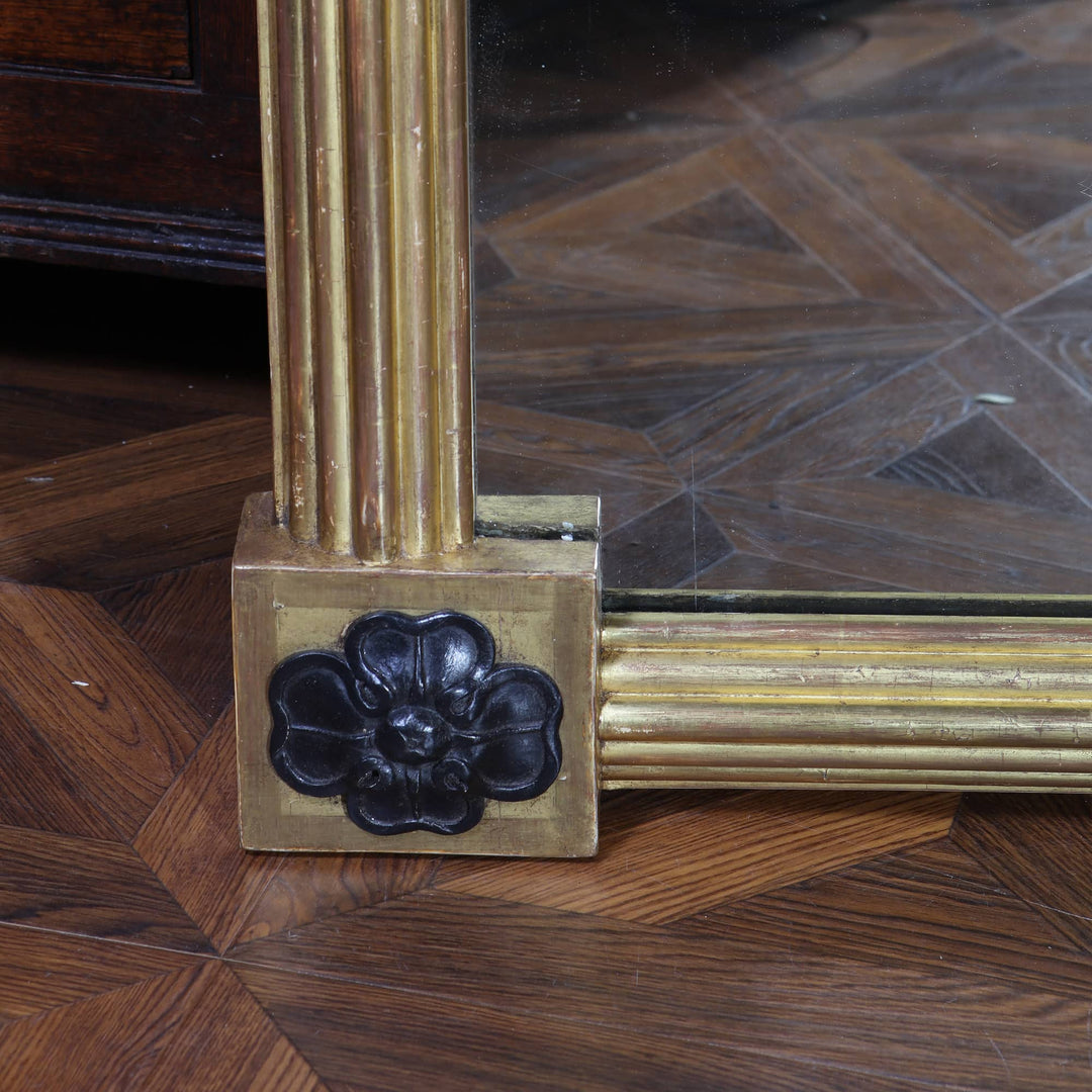 Pair of Tall Regency Giltwood Pier Mirrors with reeded frames and black floral corner detail circa 1850 England.