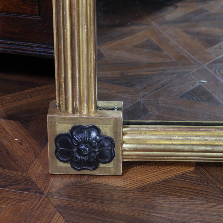 Pair of Tall Regency Giltwood Pier Mirrors with reeded frames and black floral corner detail circa 1850 England.