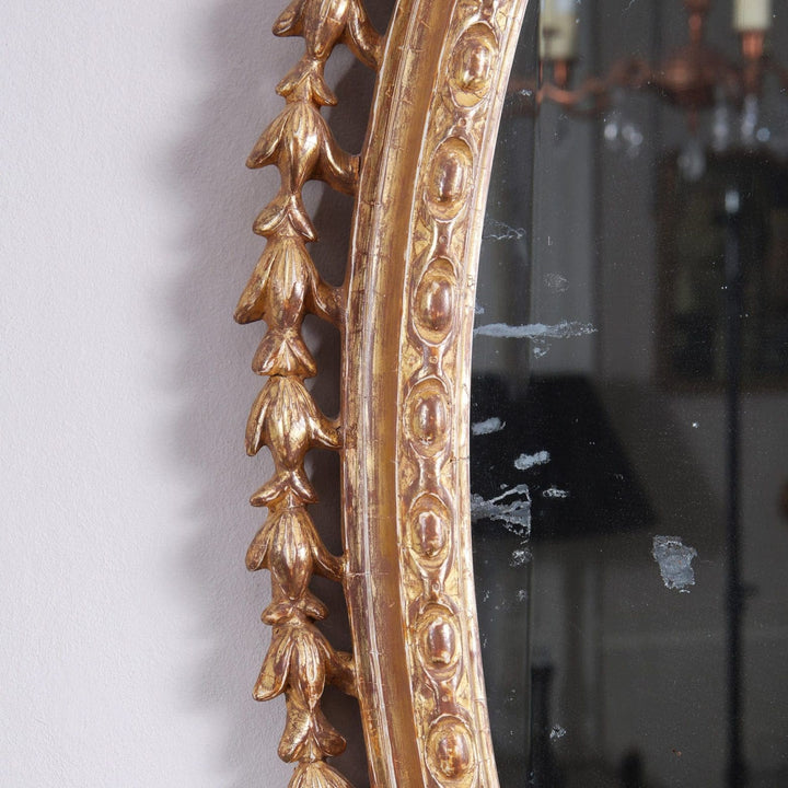 18th Century Carton Pierre Gilt Wall Mirror with detailed giltwood frame and ornate carved decorations.