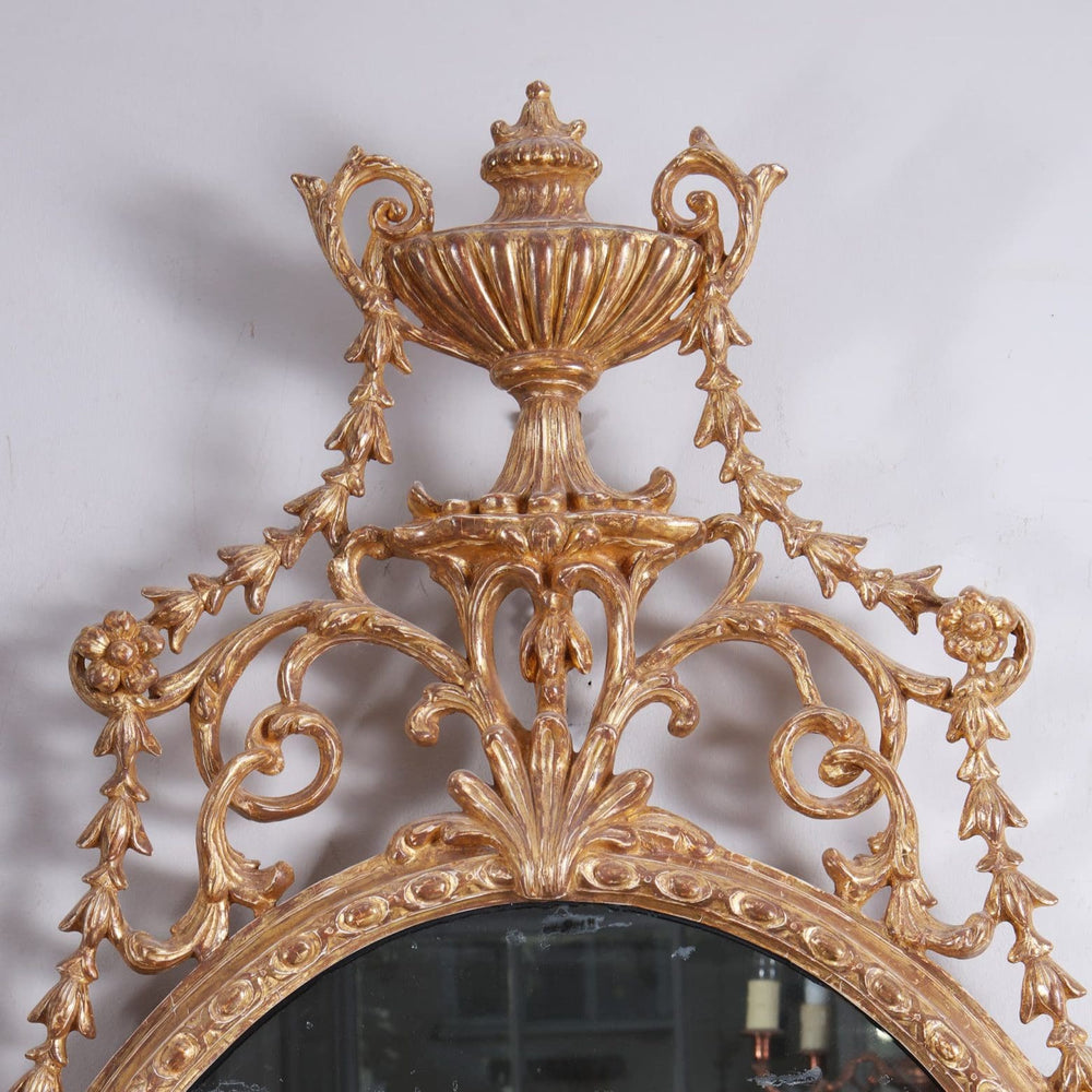 18th Century Carton Pierre Gilt Wall Mirror with ornate urn crest and foliate giltwood decoration circa 1775.