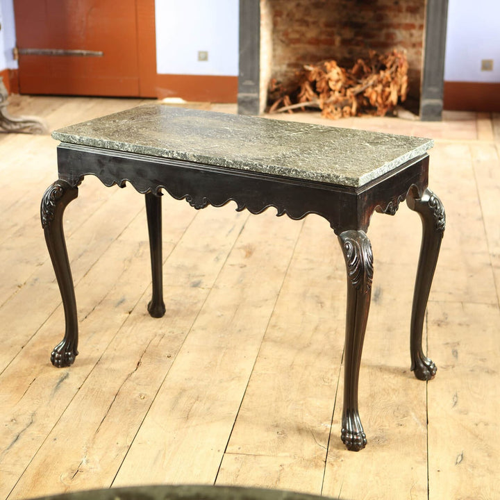 Anglo Indian Ebonised Centre table with green marble top, cabriole legs, acanthus knees, and paw feet circa 1850.