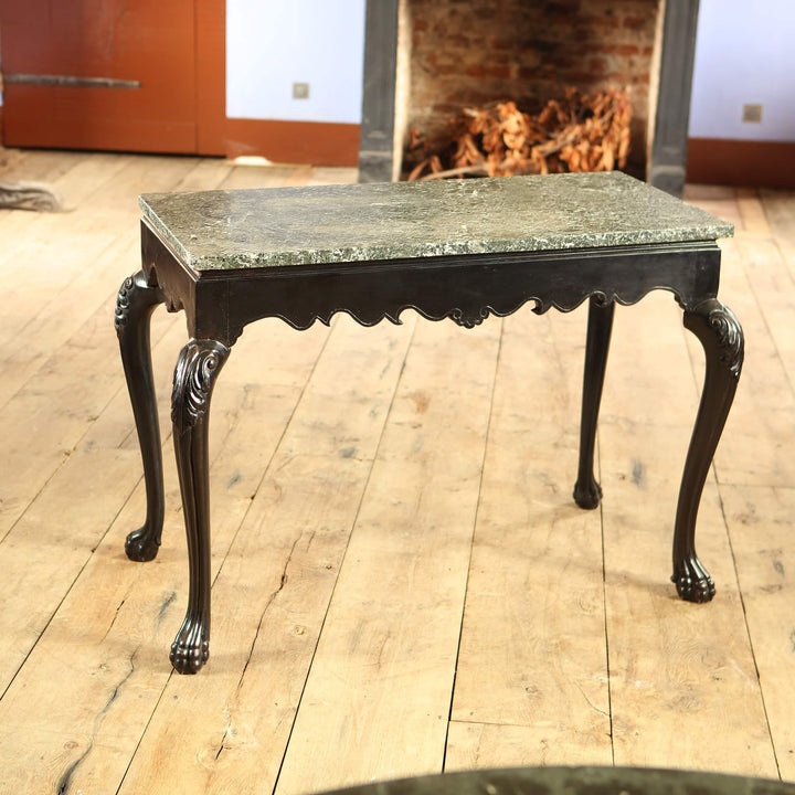 Anglo Indian Ebonised Centre table with green marble top, cabriole legs, acanthus leaves, and paw feet from circa 1850.